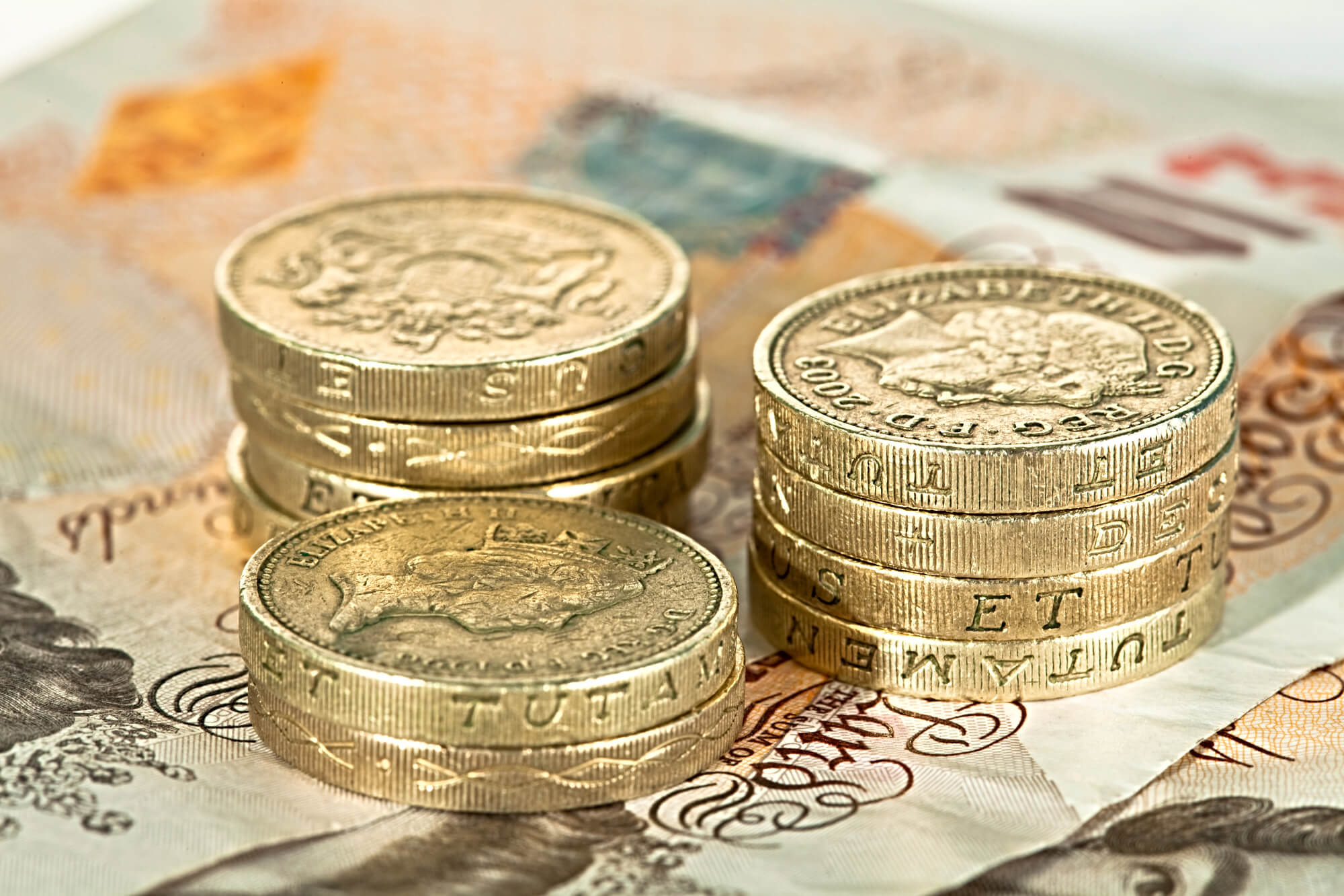 Bunch of pound coin on a table