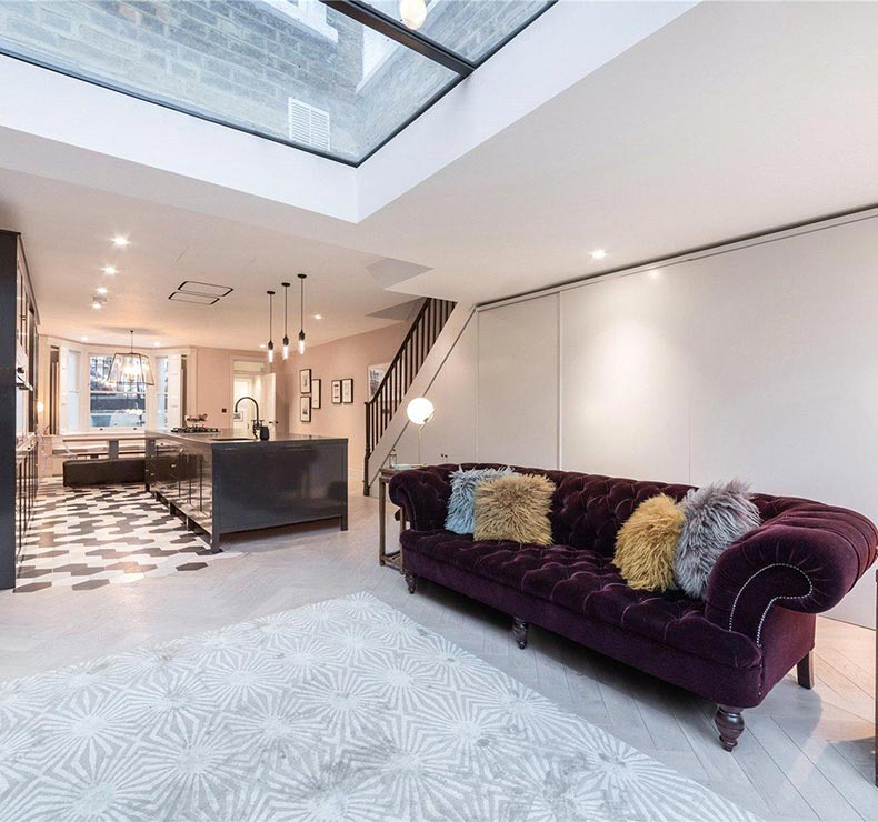 purple basement sofa in a open plan space